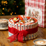Cesta Kinder de Navidad con lazo rojo y surtido de chocolatinas dentro de caja regalo navideña
